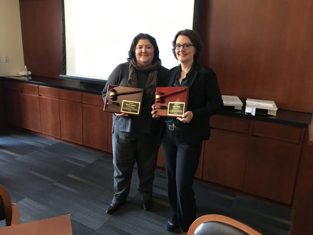 Anne Toale receiving an award from the VIP Bar Association