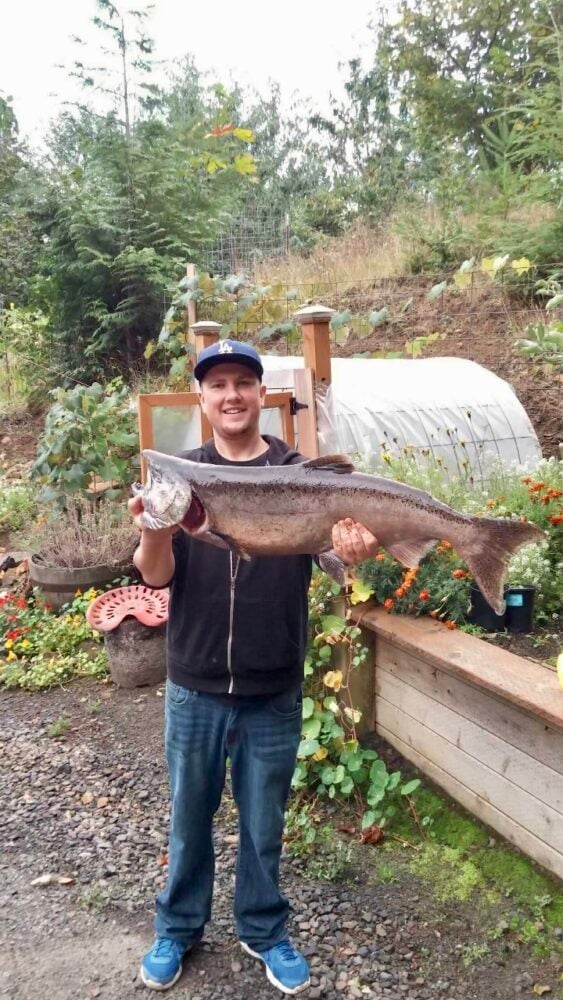 Photo of Jordan McKibbon holding a fish